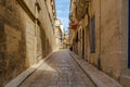 Shady medieval street in Birgu, Malta Royalty Free Stock Photo
