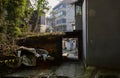 Shady old dwelling buildings on slope