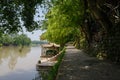 Shady riverside path at sunny summer noon