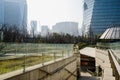 Shady stairway in misty modern city at sunny winter noon