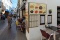 Tossa de Mar, Spain, August 2018. Interior of a street restaurant on a narrow street of a seaside town.
