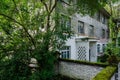 Shady walled brick building of abandoned 1960s` factory