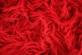 Shaggy carpet with wool material for backgrounds texture, close up of soft romantic pastel red and fluffy Royalty Free Stock Photo