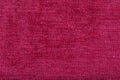 shaggy surface. fine grain felt red fabric. texture polyester close-up. dark pink fleecy background Royalty Free Stock Photo