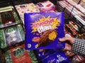 SHAH ALAM, MALAYSIA - 8 October 2020 : Hand hold a boxed of CADBURY Crunchie Blast ice cream for sell in the supermarket