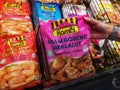 SHAH ALAM, MALAYSIA - 8 October 2020 : Hand hold a frozen packed of RAMLY Coated Fried Chicken for sell in the supermarket.