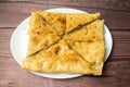 shahi Mughlai paratha served in dish isolated on wooden table top view indian spices food Royalty Free Stock Photo