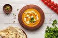 Shahi paneer traditional Indian vegetarian masala gravy meal vegetables, white sauce and butter paneer in clay bowl