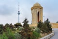 Shahidlar Monument or Eternal flame Monument on Martyrs` Lane. And Tv tower in the evening. Baku. Azerbaijan