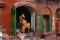 Shaiva sadhu seeking alms on the banks of Ganges river