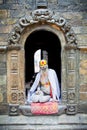 Shaiva sadhu seeks alms on the Pashupatinath Temple in Kathmand