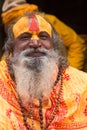 Shaiva sadhu smiling and posing on the street