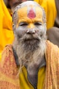 Shaiva sadhu smiling and posing on the street