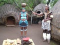 SHAKALAND, SOUTH AFRICA - CIRCA NOVEMBER 2011: Unidentified Zulu woman balancing water pot on head