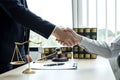 Shake hand Professional man lawyers work at a law office There are scales, Scales of justice, judges gavel, and litigation