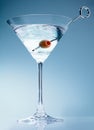 Shaken martini cocktail with olive Royalty Free Stock Photo