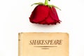 Shakespeare book and red rose