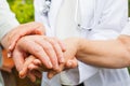 Shaking elderly hands Royalty Free Stock Photo