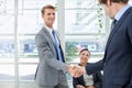 Shaking hands, collaboration and business people in office for agreement, partnership or deal. Smile, meeting and Royalty Free Stock Photo