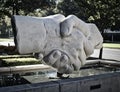 Shaking hands concrete monument