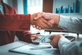 Shaking hands with congratulations on an evil plan Royalty Free Stock Photo