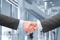 Shaking hands in hall of business center Royalty Free Stock Photo