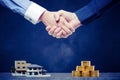 Shaking hands with save money and home Royalty Free Stock Photo
