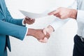 Shaking hands after signing business contract