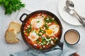 Shakshouka, eggs poached in sauce of tomatoes, olive oil. Mediterranean cousine