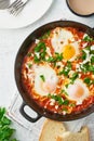 Shakshouka, eggs poached in sauce of tomatoes, olive oil. Mediterranean cousine Royalty Free Stock Photo