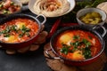 Shakshouka, eggs poached in sauce of tomatoes, olive oil, peppers, onion and garlic Royalty Free Stock Photo