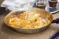 Shakshouka with red peppers & tomato paste, eggs, ras-el-hanout, chipotle peppers and pickled nopales, salsa