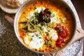 Shakshouka with peppers & tomato paste, eggs, ras-el-hanout, chipotle peppers and pickled nopales