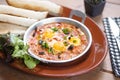 Shakshouka. Shakshouka is a Tunisian and Israeli dish containing of tomatoes, onions, pepper, spices, and eggs. It is sometimes Royalty Free Stock Photo