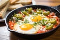 shakshuka with feta chunks, focused on cheese texture Royalty Free Stock Photo