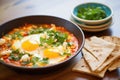 shakshuka with feta chunks, focused on cheese texture Royalty Free Stock Photo