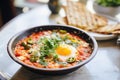 shakshuka with feta chunks, focused on cheese texture Royalty Free Stock Photo