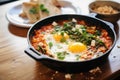 shakshuka with feta chunks, focused on cheese texture Royalty Free Stock Photo