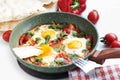 Shakshuka in pan on white background