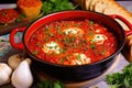 shakshuka in a red enamel pot with a wooden spoon Royalty Free Stock Photo