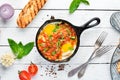 Shakshuka Scrambled eggs with tomatoes and vegetables. Breakfast. In the plate. Top view. Flat lay composition