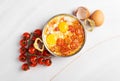 Shakshuka with tomatoes on a light background Royalty Free Stock Photo