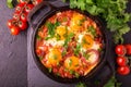 Shakshuka. Traditional Israeli cuisine. Fried eggs with vegetables Royalty Free Stock Photo