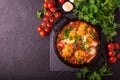 Shakshuka. Traditional Israeli cuisine. Fried eggs with vegetables Royalty Free Stock Photo