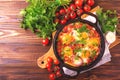 Shakshuka. Traditional Israeli cuisine. Fried eggs with vegetables Royalty Free Stock Photo