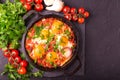 Shakshuka. Traditional Israeli cuisine. Fried eggs with vegetables Royalty Free Stock Photo