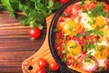 Shakshuka. Traditional Israeli cuisine. Fried eggs with vegetables Royalty Free Stock Photo