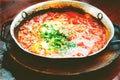 Shakshuka. Traditional jewish food and middle eastern cuisine recipe. Fried eggs, tomatoes, bell pepper and parsley in a Royalty Free Stock Photo