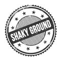 SHAKY GROUND text written on black grungy round stamp