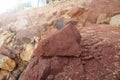 A piece of red shale sedimentary rock on nature background. Royalty Free Stock Photo